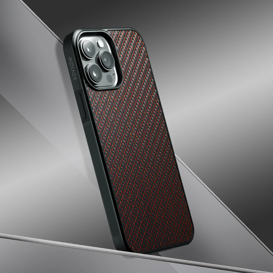 Red carbon fiber iPhone case on reflective silver surface luxury finish